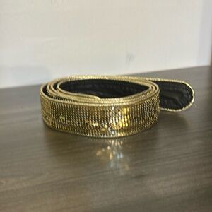 Gold Lame belt with black leather back.